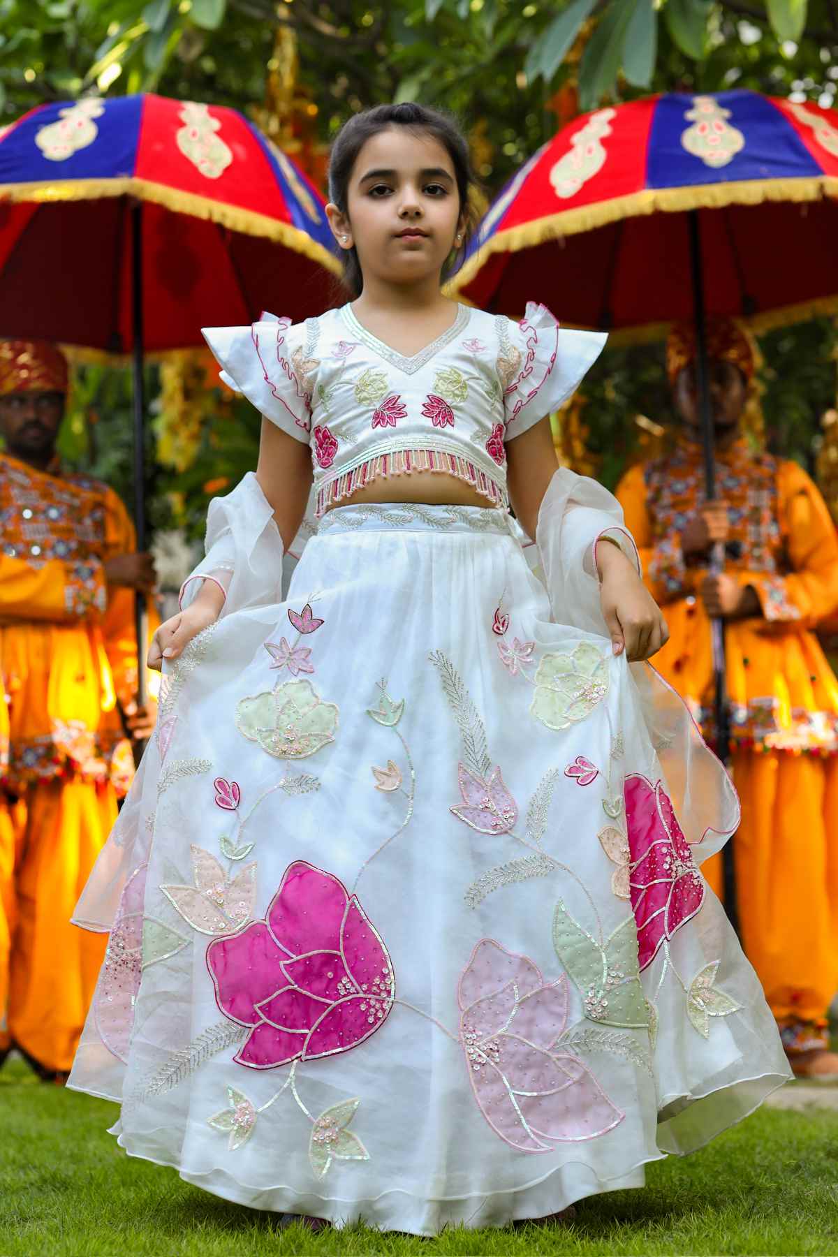 Buy Kids Designer Littleens Organza appliqué in multi-floral shades with sequins and thread embroidery on delicate tulle lehenga paired with romantic sleeve blouse and delicate sheer dupatta Online at ScrollnShops